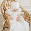 Baby wearing long gown for baptism.