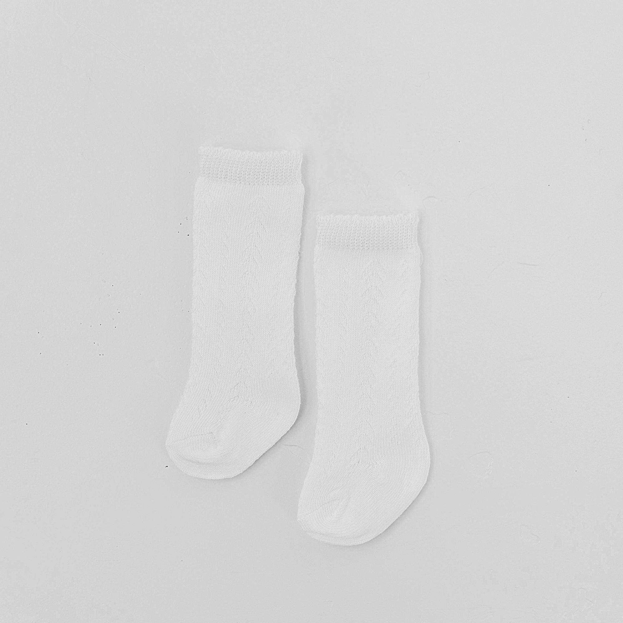 White socks for baby gift for special occasions.