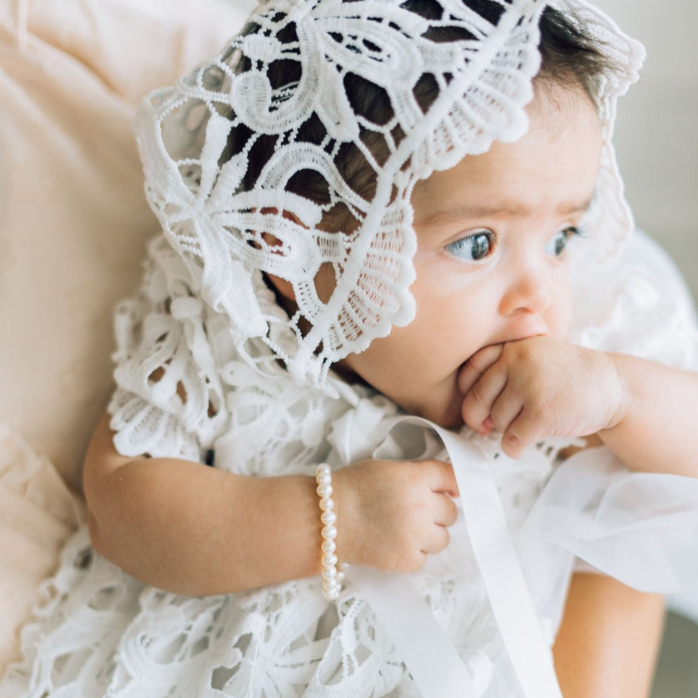 Christening white dress on child.