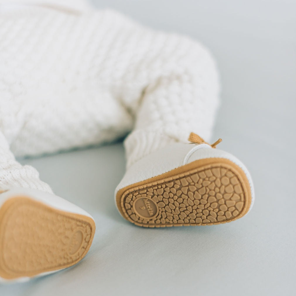 Brown sole baby boy shoes white.