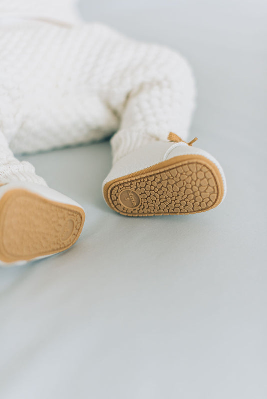Brown sole baby boy shoes white.